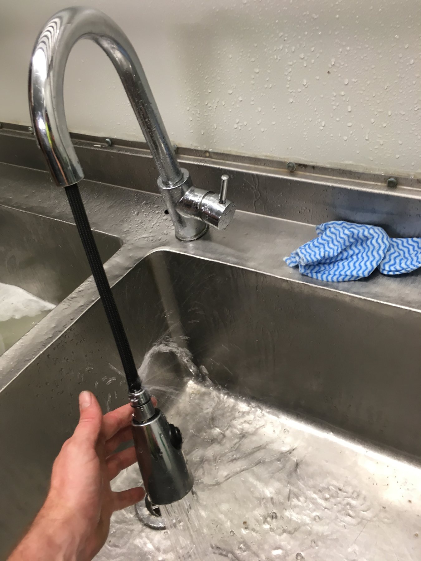 Commercial kitchen tap and sink installation.