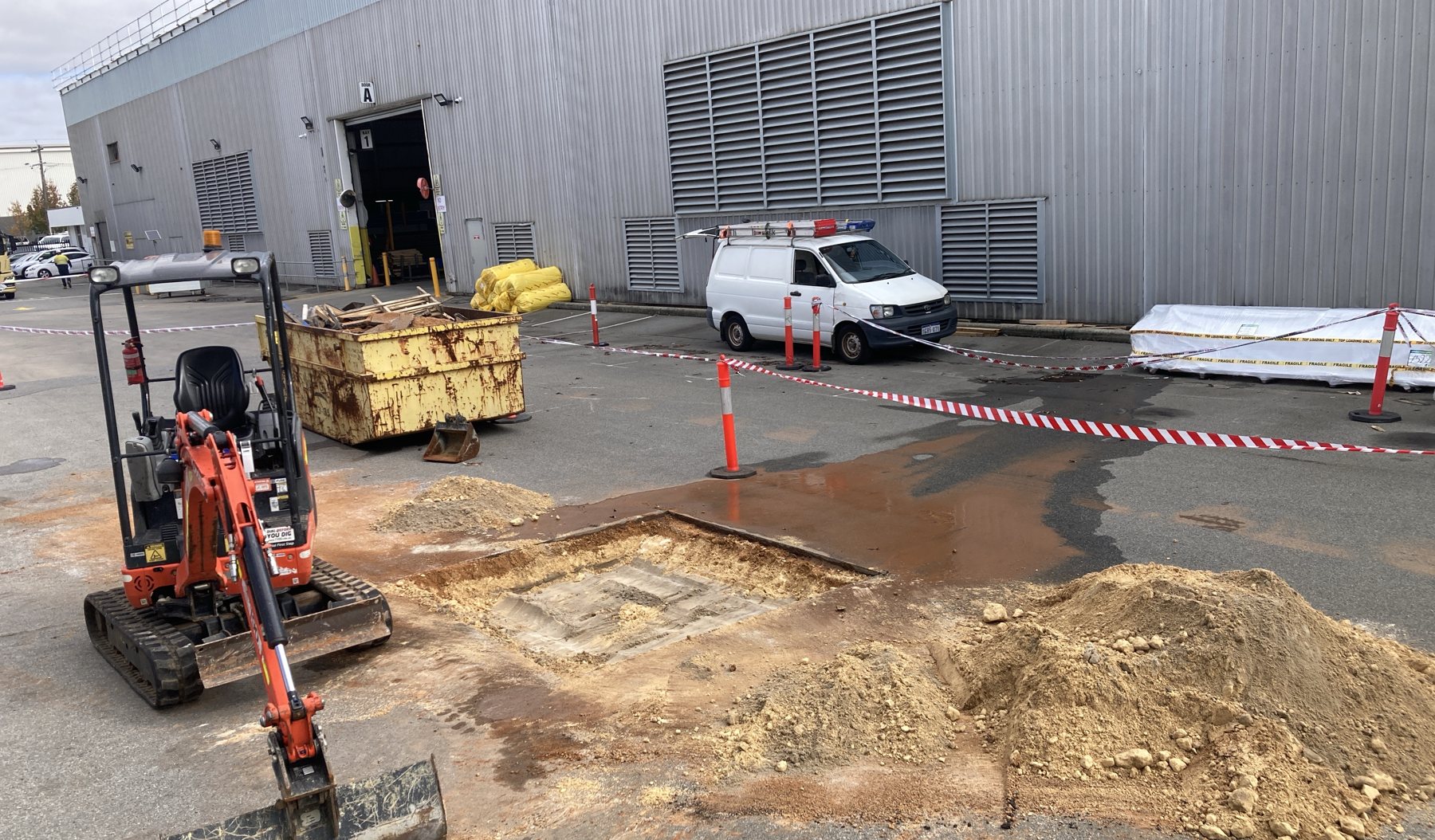 Underground drainage pipework laid in an open excavation.